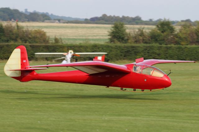 — — - A Slingsby Petrel Type 13 Vintage Glider comes into land at Old Warden Aerodrome.