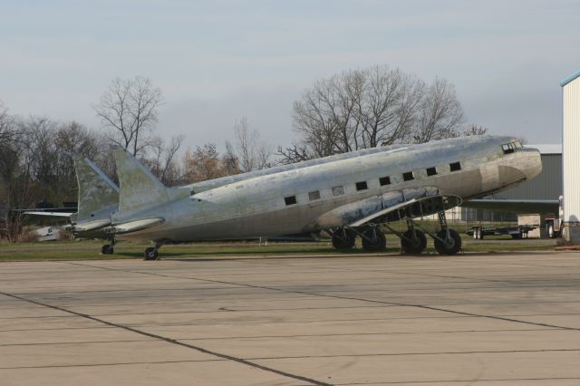 — — - Two DC-3s Await Retrofiting at Basler Aviation Oshkosh, WI