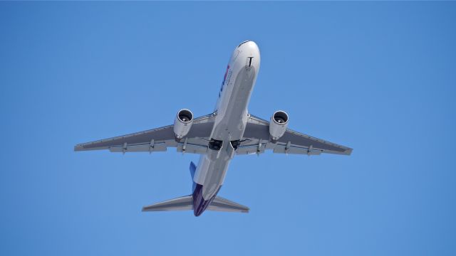 BOEING 767-300 (N110FE) - BOE564 climbs from Rwy 16R to begin a flight test on 12/2/14. (ln 1074 / cn 43542).