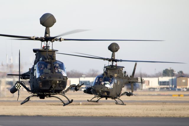 Bell JetRanger (9600026) - OH-58D Kiowa Warriors, of the 1-230th Air Cav, of the Tennessee NG, arrived on a pit stop. On their way to Ft. Hood, Texas, for pre-deployment training. The rear view of the Kiowa Warrior with some detail. On the right side they carry the M260 7-shot 2.75-inch rocket pod, and on the left the M3P .50 caliber machine gun. -February 2014