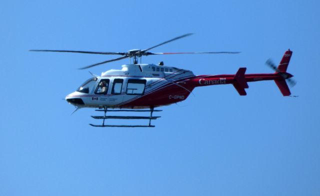 Bell 407 (C-GPND) - Shown here is a Bell 407 Helo making a low pass over the airfield in the Spring of 2018.