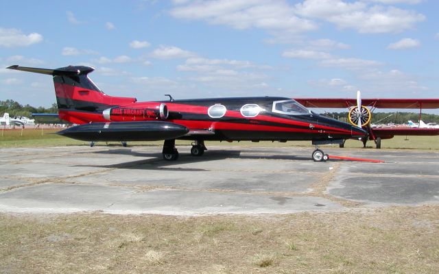 Learjet 24 (N23BY) - This Learjet performed a barrel roll after takeoff then touched back down on the same runway seconds later. Wish I had a still shot. I do have it on video from 2004. Great piloting!