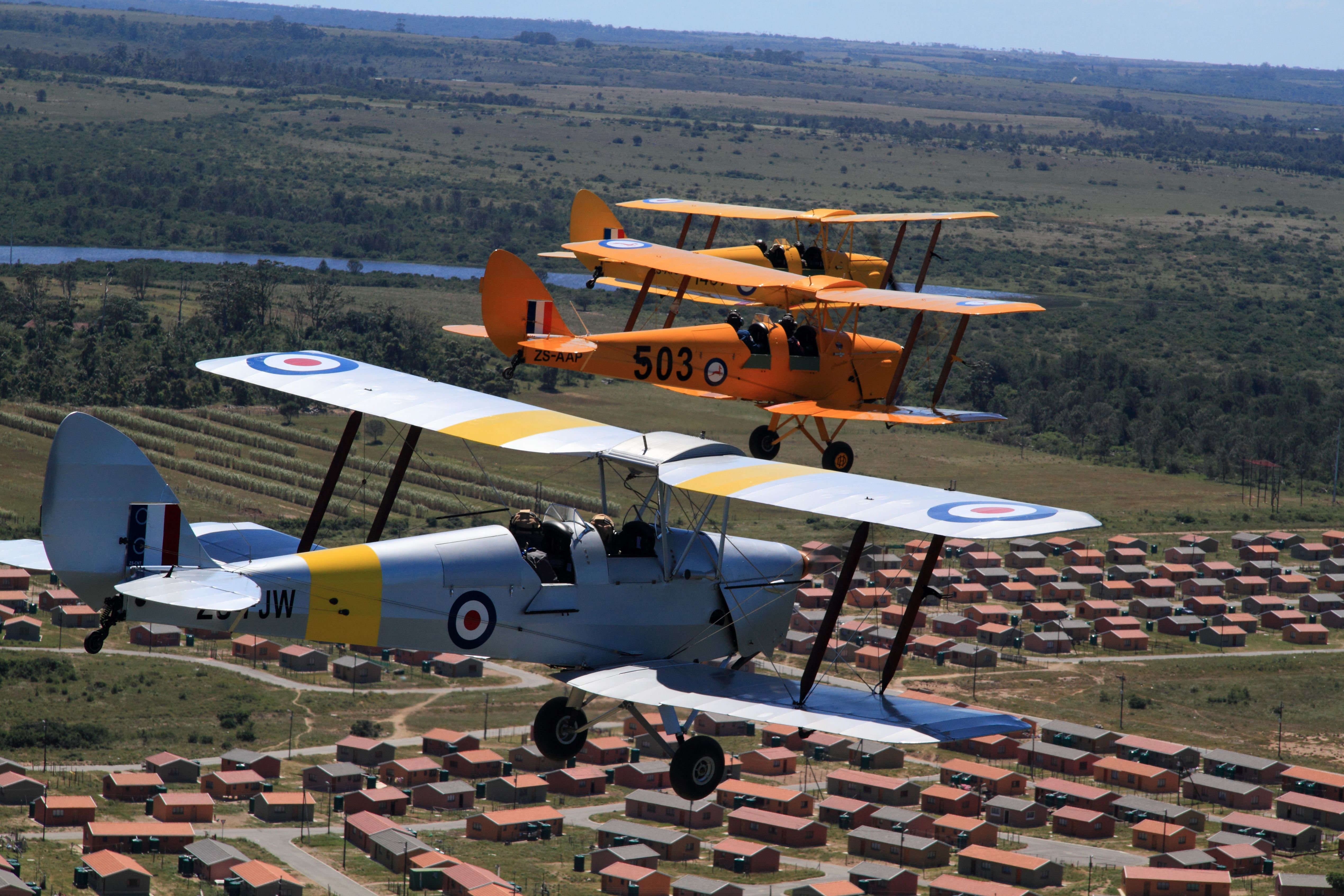 — — - At the 80th Anniversary of the first Tiger Moth Flight. n nPlying over Port Alfred, EC, South Africa.