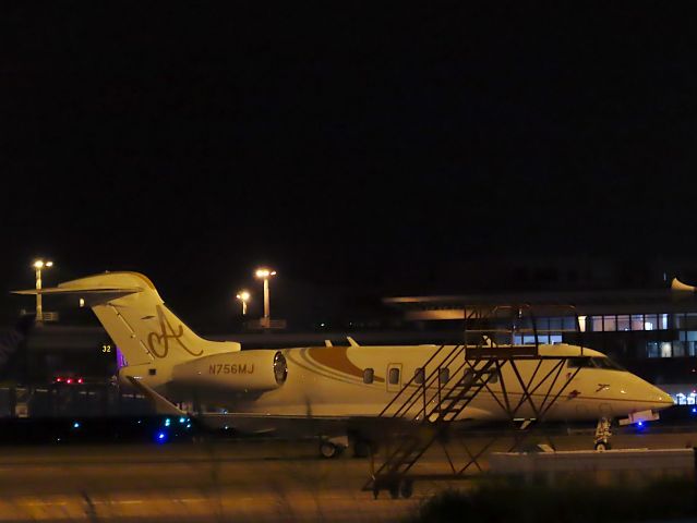Canadair Challenger 350 (N756MJ) - Photo taken on Sep 30, 2022.br /Unfortunately, the ramp and weeds in the foreground made for a very ugly photo.