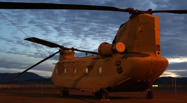 Boeing CH-47 Chinook (1008801) - Early dawn capture finds this US Army Boeing CH-47F Chinook still being illuminated by ramp lighting as the sun is just moments away from rising over the distant hilltops. 