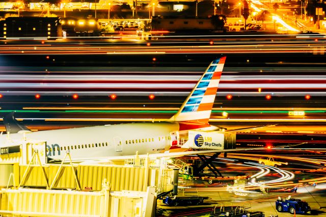 Boeing 787-8 (N805AN) - American Airlines 787-8 parked at PHX on 12/17/22. Taken with a Canon R7 and Tamron 70-200 G2 lens. 7 minutes of stacked 10 second exposures. Ground vehicles and passing aircraft are turned into streaks of light due to the very slow shutter speed. 