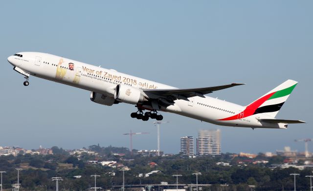 BOEING 777-300ER (A6-ECE) - Climbing from Rwy 34L