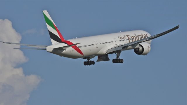 BOEING 777-300 (A6-EGU) - UAE777 climbs from runway 16R beginning the delivery flight to OMDB / DXB on 7/13/12. The aircraft is a B777-31H(ER) LN:1028.