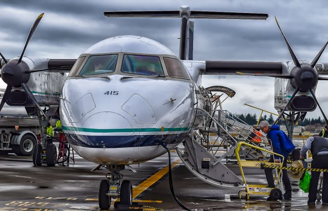 de Havilland Dash 8-400 (N415QX) - Alaska 2030 sitting on the ramp on a typical Seattle day for its flight to Helena