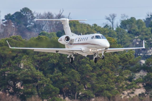 Embraer Phenom 300 (N335QS) - This is a photo of N335QS, a 2014 Embraer Phenom 300 on final for Atlanta's PDK executive airport. I shot this with my Canon 800mm lens. The camera settings were 1/2700 shutter, F6.3 ISO 640. I really appreciate POSITIVE VOTES & POSITIVE COMMENTS. Please check out my other aircraft photography. Questions about this photo can be sent to Info@FlewShots.com