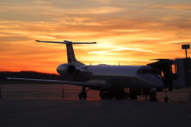 Embraer ERJ-145 (N697AB) - ENY3548 at the gate with an amazing sky above tonight, 13 Dec 2021.