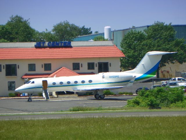 Gulfstream Aerospace Gulfstream IV (N450PG) - Staying cool on a hot tarmac this Gulfstream is shown here in the Spring of 2014.