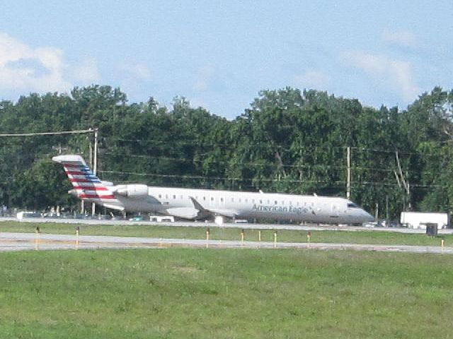 Canadair Regional Jet CRJ-900 (N574NN) - Taken from VTaNG Fire Station.