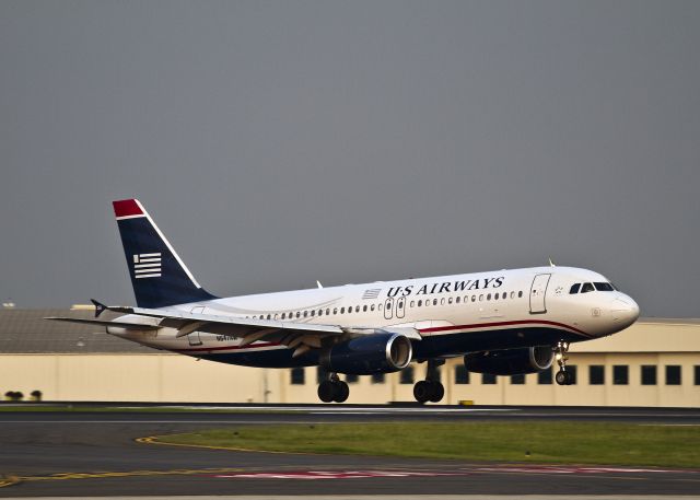 Airbus A320 (N647AW) - An evening landing on runway 23.