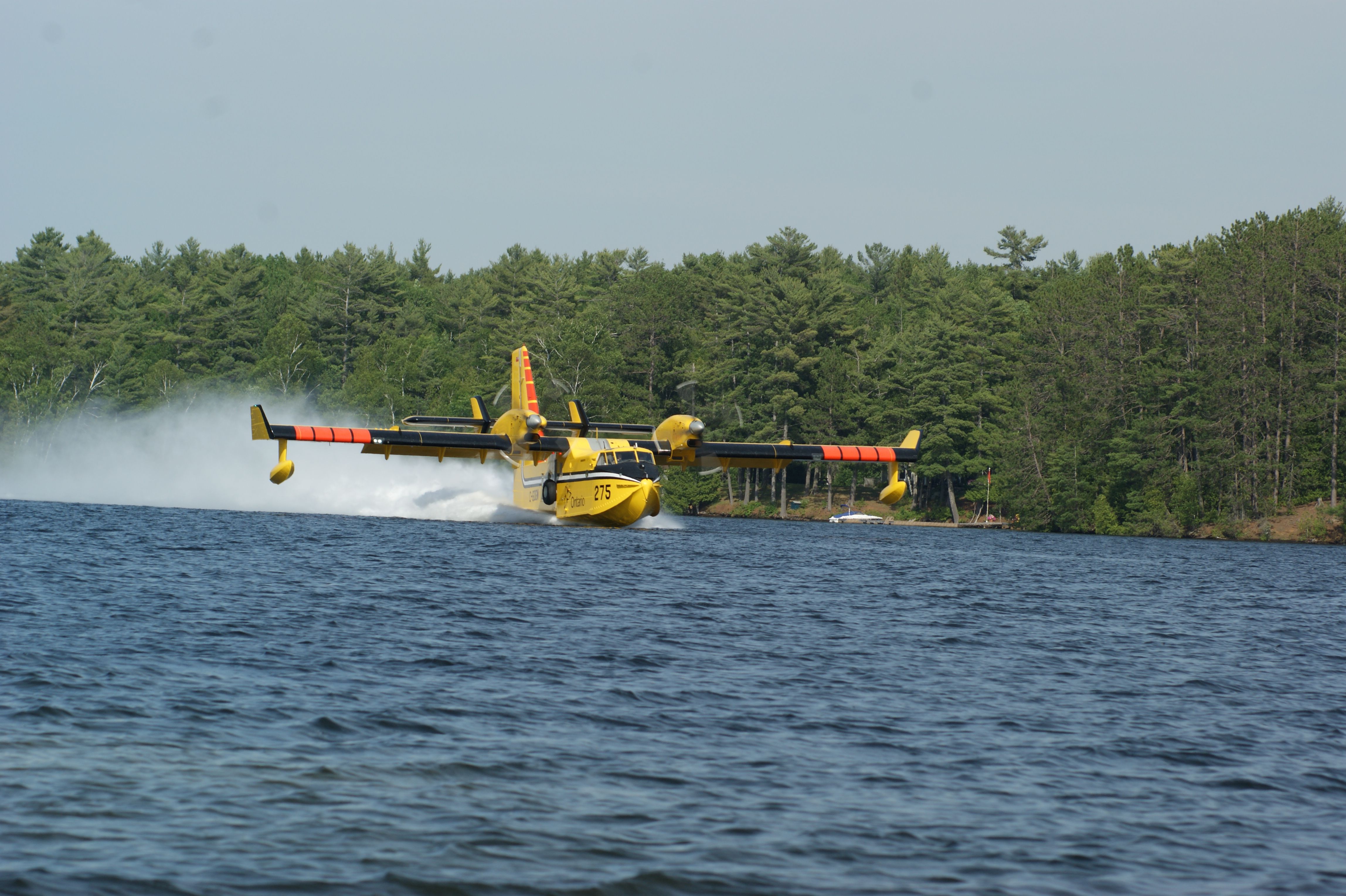 Canadair CL-41 Tutor (C-GOGW) - Crystal Lake, Ontario taken from our boat we had an awesome view as two SuperScoopers fought a nearby forest fire we could not see.