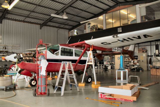 Cessna Super Skymaster (H4-DAL) - Solomon Islands registered 337 undergoing maintenance showing its old G-HIVA registration also. February 2016