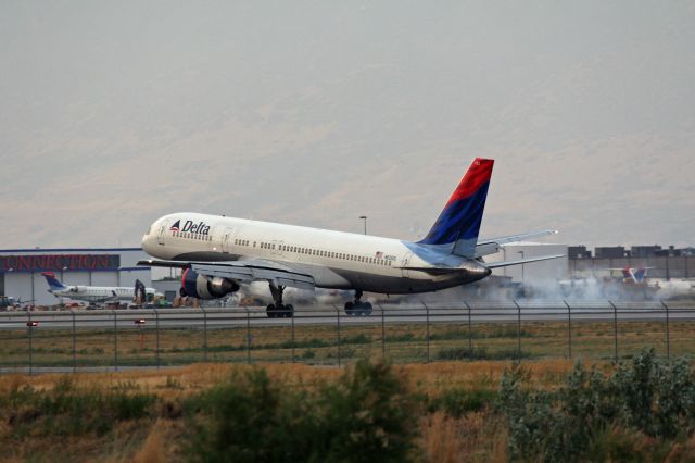 Boeing 757-200 (N625DL) - Smoling the tires on Runway 34R