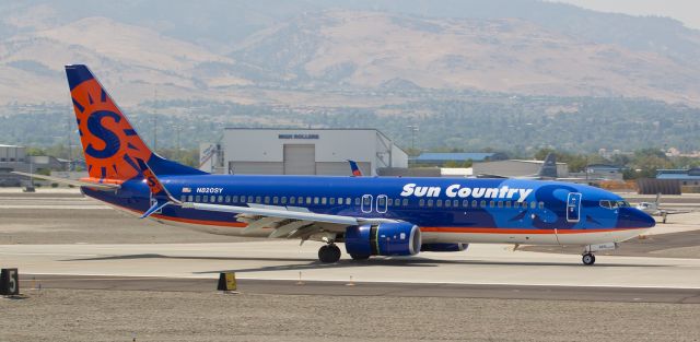 Boeing 737-800 (N820SY) - Here come the Marines!  This shot captures the second of five Sun Country arrivals at Reno Tahoe International yesterday as the packed-to-the-max-with-Marines B738 hammers in reverse thrust after landing on runway 34R around 1:25 in the afternoon.  The five SCX charters were all coming from Cherry Point (KNKT) transporting hundreds of US Marines to KRNO for a training encampment in CA.  This particular SCX fleetbird* remained in Reno overnight and then ferried out earlier this morning to JB Elmendorf (PAED) in Alaska.br /* This new addition to the Sun Country fleet is sporting those super sharp-looking spilt scimitar winglets! 