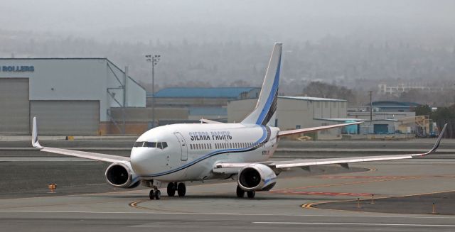 Boeing 737-500 (N709S) - One-half of Sierra Pacific's entire two-jet fleet is shown here as N709S, a B735, is cleared to taxi across Runway 34R-16L after landing on the parallel (34L-16R).br /SPA is the fifth owner of this quarter-century old Boeing. N709S is ex-Maersk as OY-API; ex-Sterling still as OY-API; ex-Dniproavia as UR-DND, and ex-Ukraine International as UR-GBC. By finding this B735 in storage and buying it, Sierra Pacific just may have saved it from being destroyed when Russia attacked Ukraine two months ago.