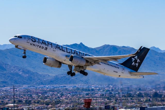 Boeing 757-200 (N14120) - A United Airlines 757-200 in Star Alliance special livery taking off from PHX on 2/24/23. Taken with a Canon R7 and Canon EF 100-400 ii lens.