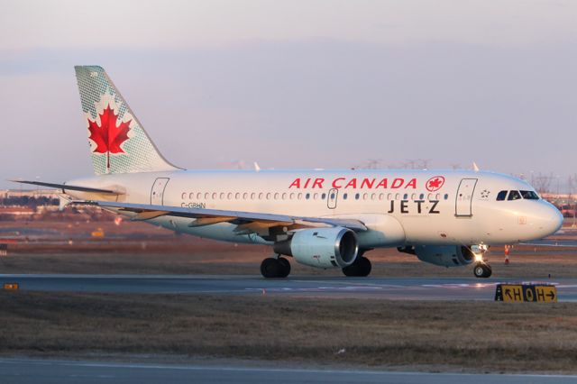 Airbus A319 (C-GBHN) - Air Canada Jetz taxiing for departure just after sunrise