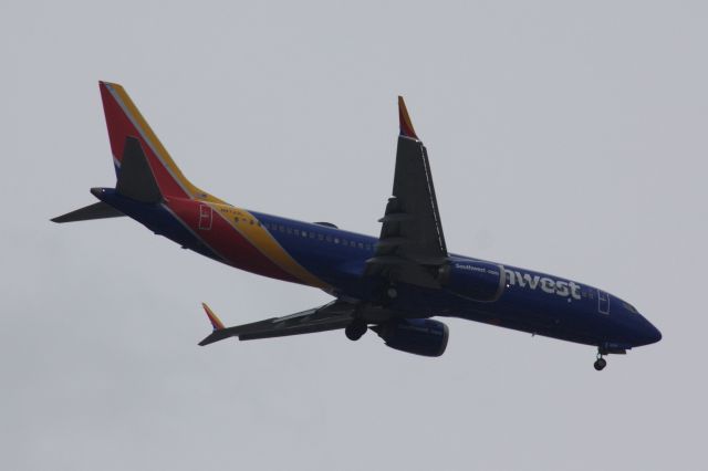 Boeing 737 MAX 8 (N8720L) - Southwest B737 MAX 8 returning to the skies seen arriving to Boston Logan from Nashville on 4/15/21. I got out of work just in time to take this photo from the parking lot. 