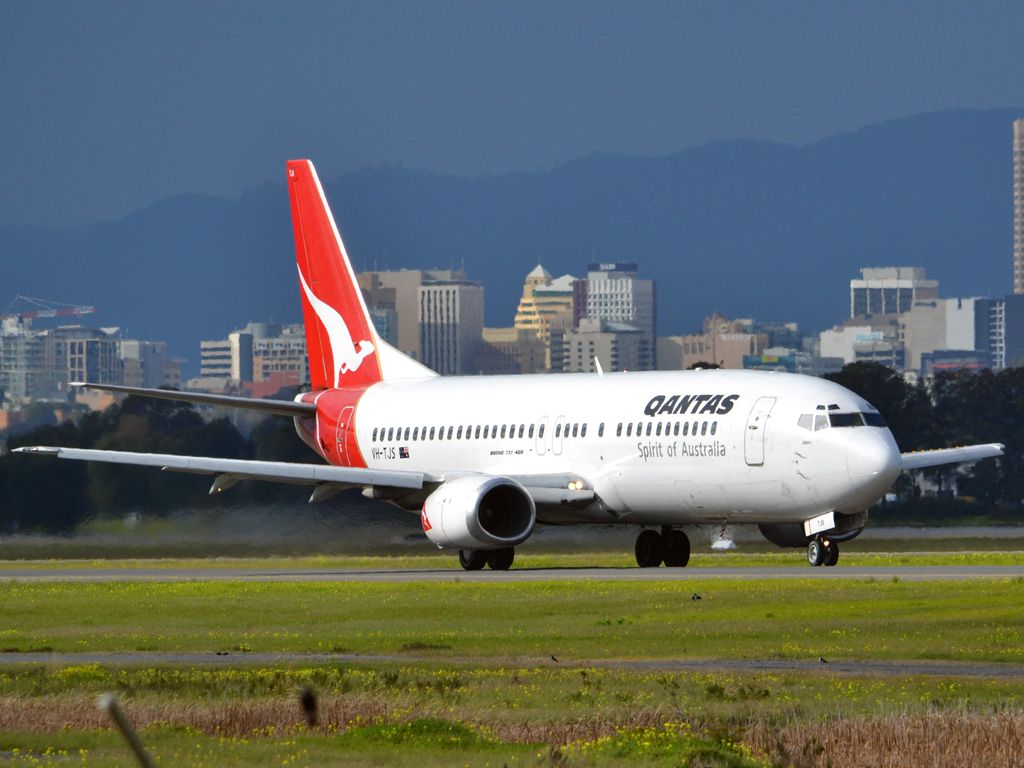 BOEING 737-400 (VH-TJS) - On taxi-way heading for take off on runway 05. Thursday 12th July 2012.