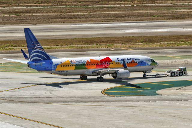 Boeing 737-800 (HP-1825CMP) - 26th July, 2015: Copas "BioMuseo" livery B738 is seen being tugged to the gate from the overnight parking spot. Biomuseo was built to celebrate biodiversity. The museum is located on the Amador Causeway in Panama City, Panama - Copas home base. The design was conceived by renowned architect Frank Gehry in 1999 and the museum opened to public in October 2014.