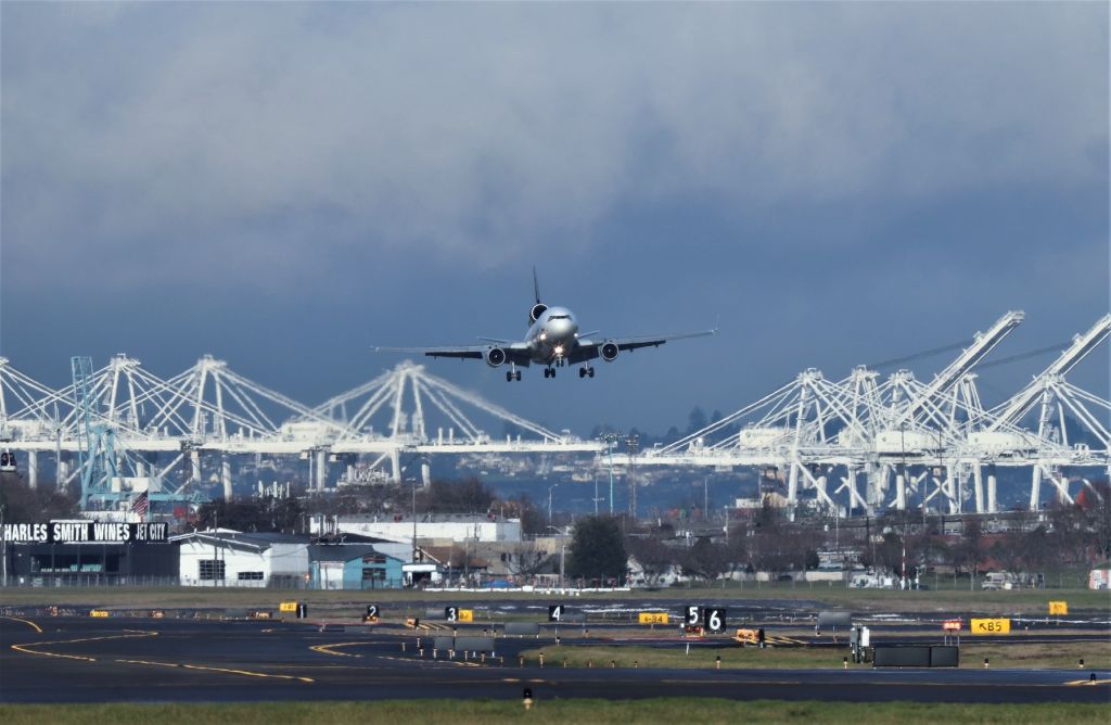 Boeing MD-11 (N280UP) - KBFI - 12/28/2019 I had just pulled up to BFI at the south end of my "Home" airport and the MD-11 was on final. I had the lens as I was just over at Boeing Renton earlier, so all I had to do was get out and walk over to the fence and snap 50+ photos on the arrival. Pre June 1964, those cranes were not there over by the old Todd Shipyards and the West Seattle bridge area at the south end of Elliot Bay. The only thing here is the awesome memories of BFI pre 1964 and the jets i saw. Dec 2019 saw BFI stuffed with 737-MAX 8s and every spot filled on the parking areas and then some.After circumventing BFI and hundreds of snaps, I had to face the music, and headed to the Memorial Service...