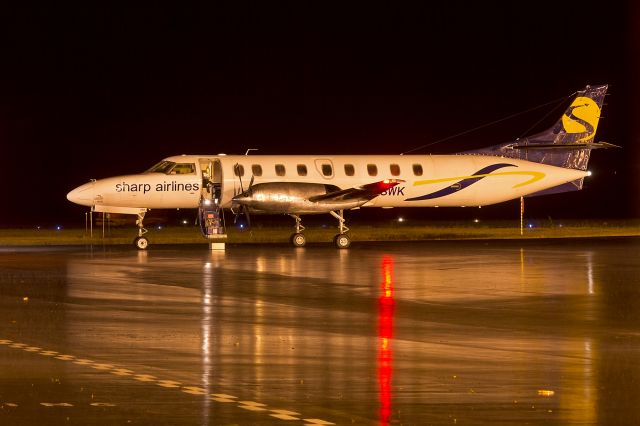 Fairchild Dornier SA-227DC Metro (VH-SWK) - Sharp Airlines (VH-SWK) Fairchild Swearingen SA-227DC Metro 23 at a very wet Wagga Wagga Airport.