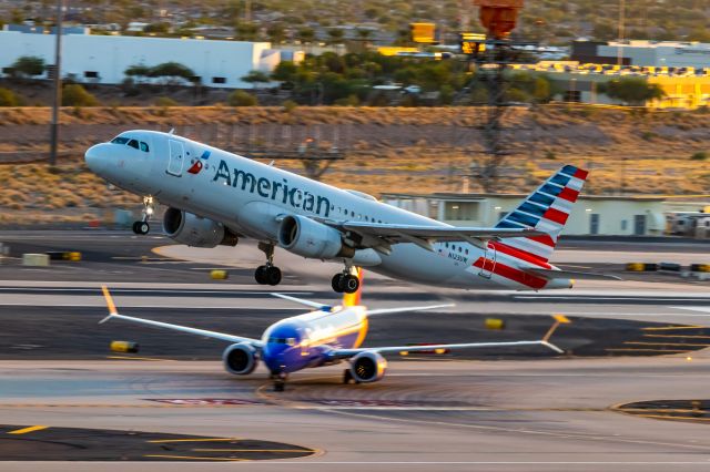 Airbus A320 (N123UW) - American Airlines A320 taking off from PHX on 10/16/22. Taken with a Canon 850D and Tamron 70-200 G2 lens.