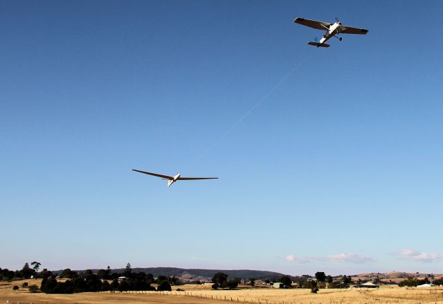 VH-BGE — - Sequence showing Cessna 150 tug tow launch at Boonah Queensland. Tug has 180hp engine.Glider is Schleicher ASK 21 of Boonah club