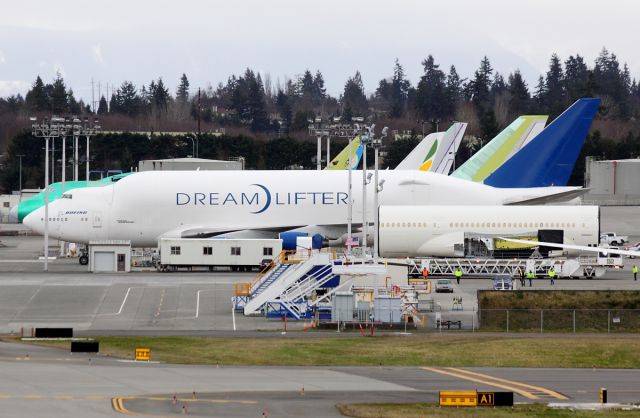 Boeing Dreamlifter (N249BA) - Boeing Large Cargo Freighter N249BA and a 787 fuselage at Paine Field February 6, 2013.