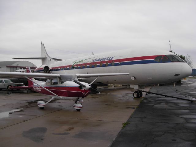 Cessna Skyhawk (N51865) - Parked next my favorite Caravelle before she was cut up. The Caravelle had a couch and a piano inside.  Lots of good memories.