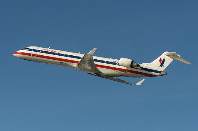 Canadair Regional Jet CRJ-700 (N514AE) - Climbing out from rwy 22L at ORD