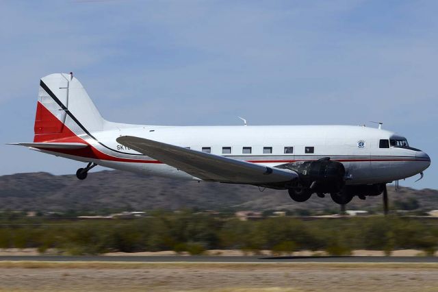 Douglas DC-3 (N86584) - Skydive Arizona DC-3 N86584 made an impressive low pass at the Copperstate Fly-in at Casa Grande.