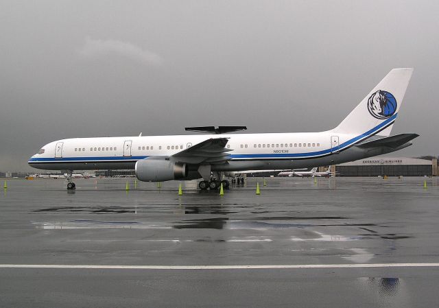 Boeing 757-200 (N801DM) - Mark Cubans "Beautiful" VIP configured 757-200 rests between flights at Five Towers at KLGA before operating a Charter for his teams Dallas Mavericks NBA team back in April 2005.