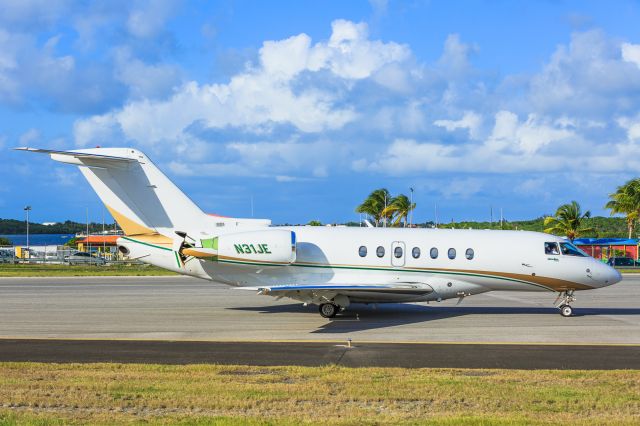 Hawker Beechcraft 4000 (N31JE) - Private Hawker Beachcraft 4000 N31JE coming to a stop after landing at TNCM. Aircraft will back track the active for parking!