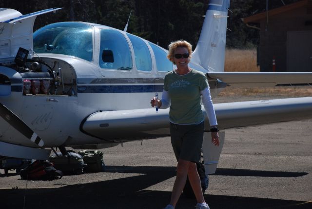 Beechcraft Bonanza (33) (N1545Y) - Little River Airport Mendocino, CA.  Amanda checking fuel.