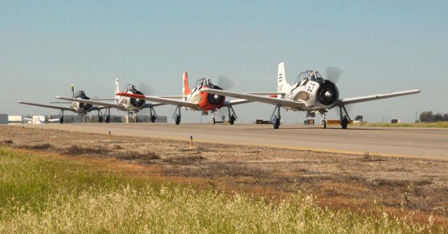 North American Trojan — - Four Trojans on taxi way.