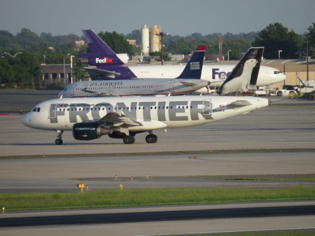 Airbus A319 (N949FR) - Taken May 4, 2014 from airport overlook. Headed to gate.