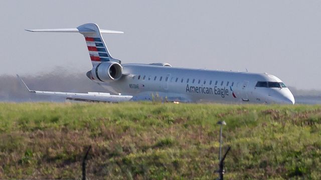 Canadair Regional Jet CRJ-700 (N513AE) - American Eagle (opby PSA Airlines) JIA5148/AA5148 from Windsor Locks/Hartford (KBDL/BDL) lands on runway 33. Former American Eagle Airlines, Envoy Air. Returned to service March 9 (20 days before this photo) after storage at Kingman (KIGM/IGM) since Aug. 2023br /Photo date: 3-29-24br /Upload date: 1-8-25