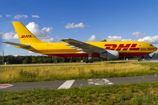 Airbus A300F4-600 (D-AEAJ) - thruogh a meshwired fence