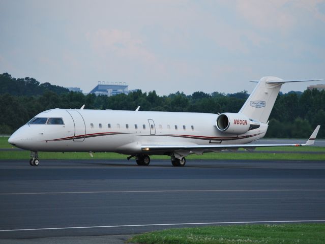 Canadair Regional Jet CRJ-200 (N60GH) - STEWART-HAAS RACING LLC returning from the Brickyard 400 at KJQF - 7/28/13 400 - 7/28/13