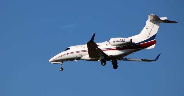 Embraer Phenom 300 (N302AZ) - On final is this 2012 Embraer Phenom 300 in the Autumn of 2020.