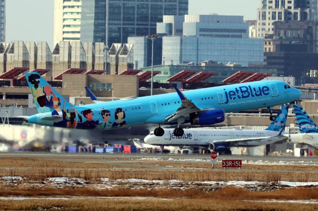 Airbus A321 (N970JB) - Jet Blue A321 in new Blue Unity special livery departing BOS on 2/8/25.