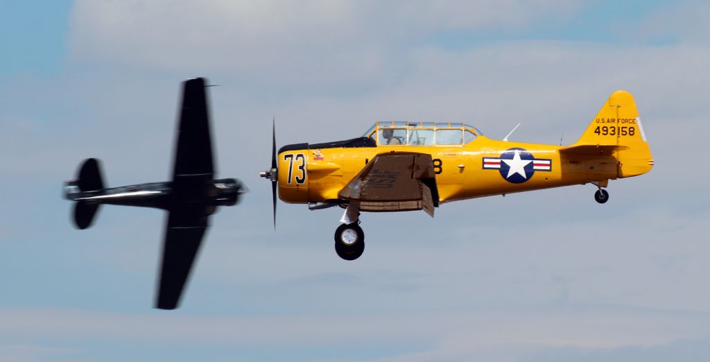 North American T-6 Texan (N158JZ) - T6 Class:br /Landing >> Race 73 .... "Miss Humboldt Hunny" .... North American T-6G ..... N158JZ (formerly 493158) .... Pilot: Loren Marburg (Indianapolis, IN)br /In the background turning Pylon One >>> Race 6 .... "Six-Cat" .... North American T-6G ..... N2897G .... Pilot: Nick Macy (Tulelake, CA)br /125v ..  21h