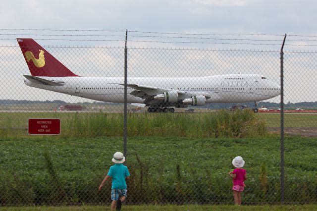 Boeing 747-200 (N705BL) - These are the kids of the Kalitta Air captain operating this flight from OSC.  They ran to the fence saying "Theres Daddy!!"  I couldnt resist capturing it, even if it meant it was a "through the fence" shot. 