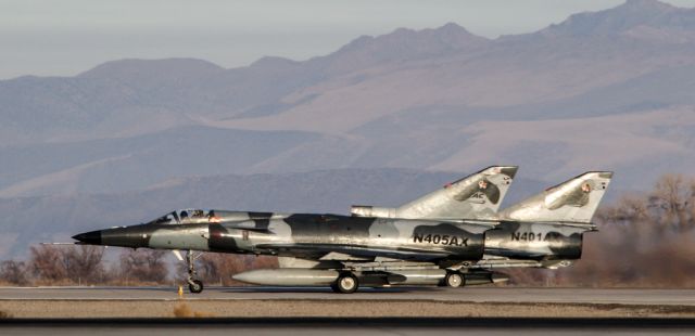 N405AX — - From the corner of Bravo & 31L at NAS Fallon, a pair of F-21 KFIRs line up to for takeoff. 