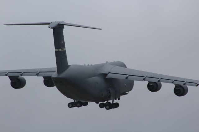 Lockheed C-5 Galaxy — - Note Position of Landing Gear Wheels as they are being Retracted.br /br /Departing Oshkosh on a Cloudy Friday 2016.